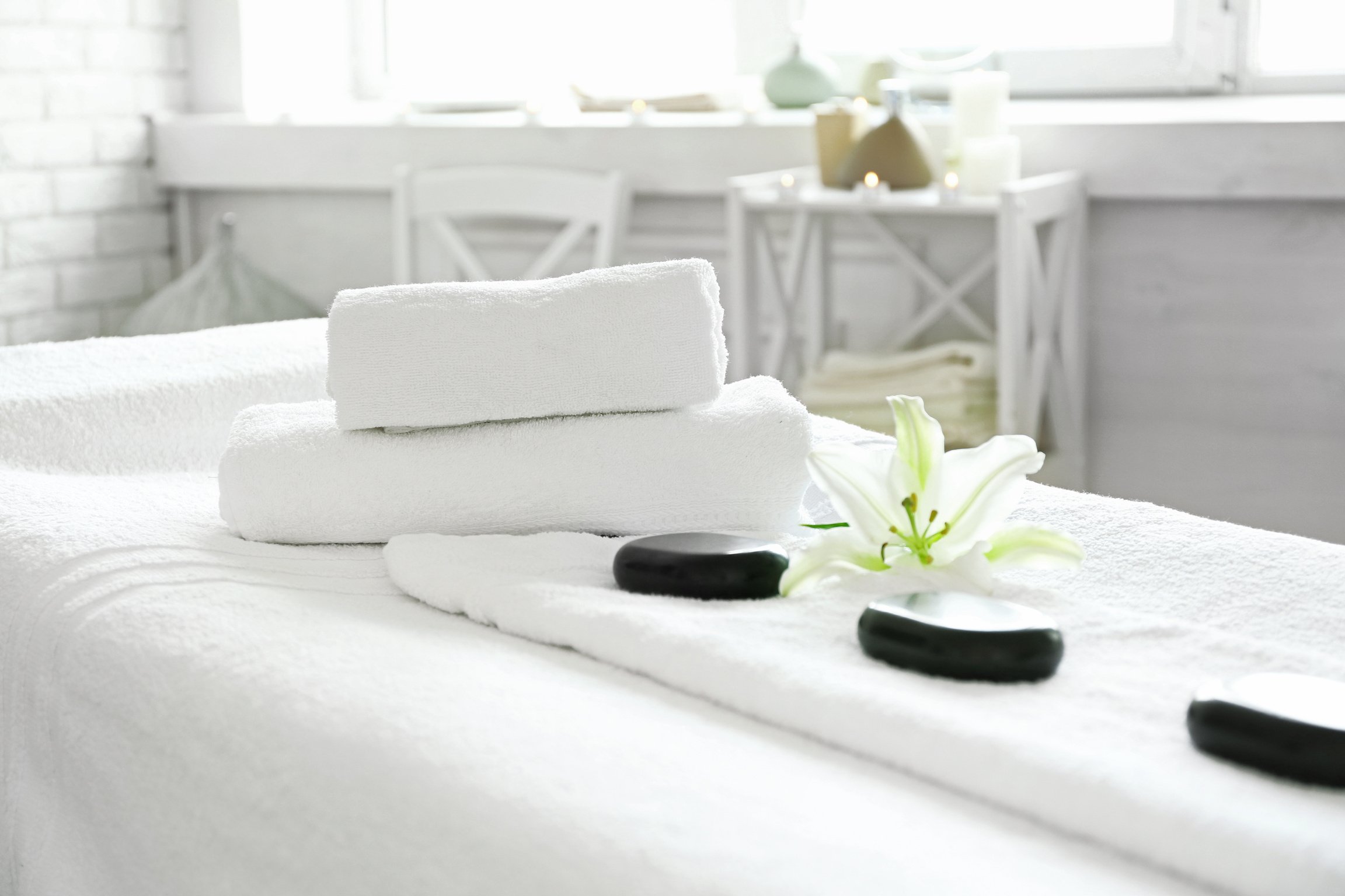 Massage Bed with Towels and Spa Stones